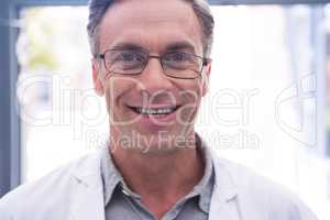Portrait of smiling dentist with eyeglasses