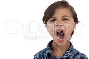 Boy shouting against white background