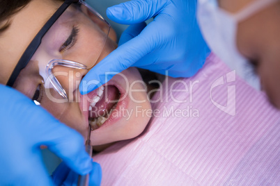Boy receiving dental treatment at medical clinic