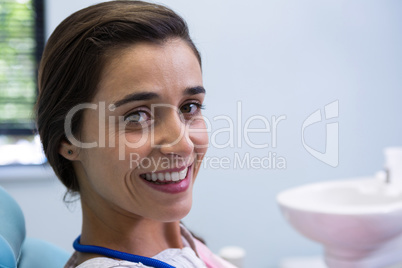 Woman smiling at dental clinic