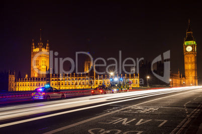 Police Cars and Ambulance on Westminster Bridge, London at Night