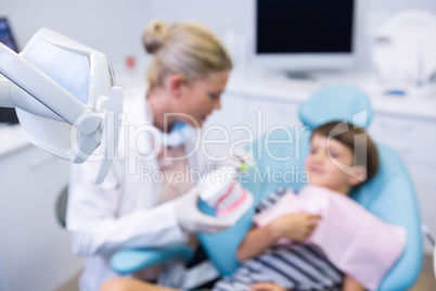 Boy receiving treatment by dentist