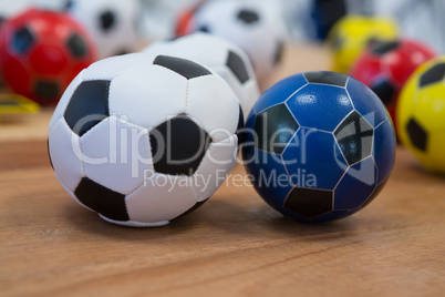 Footballs on wooden table
