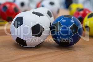 Footballs on wooden table