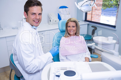 Portrait of smiling patient and dentist