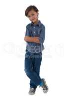 Boy standing against white background