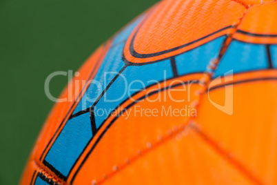 Football against green background