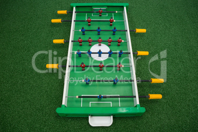 Table soccer game on artificial grass