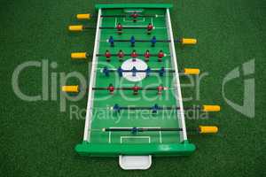 Table soccer game on artificial grass