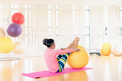 Woman exercising with exercise ball