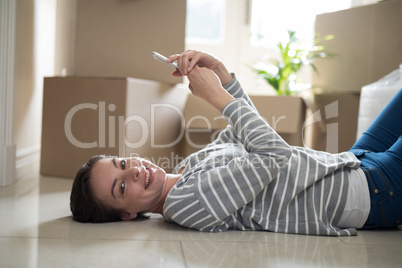 Woman using mobile phone while sleeping