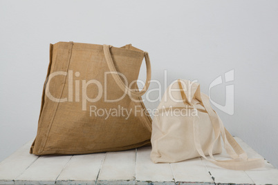 Brown and beige bags on table