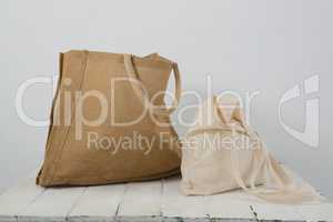 Brown and beige bags on table