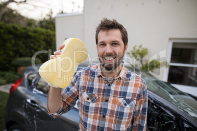 Man holding a sponge