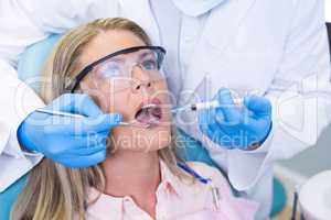 Woman receiving dental treatment at medical clinic