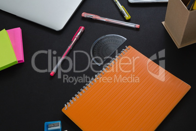 Office accessories on black background Office accessories on black background