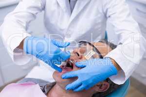 Close up of doctor giving dental treatment