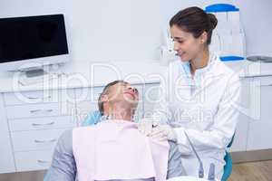 Man taking with doctor while lying on chair