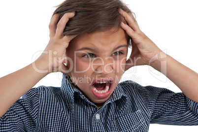 Boy standing against white background