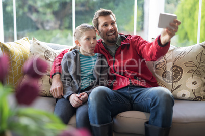 Father and daughter taking a selfie