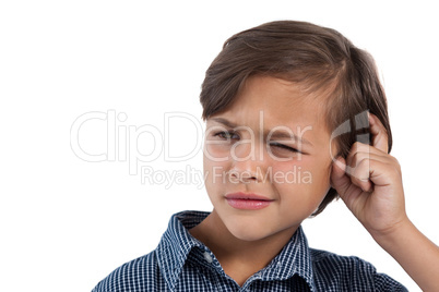 Boy standing against white background