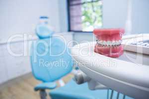 Dental mold on table by chair