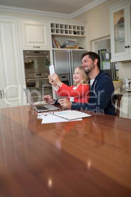 Father and daughter taking a selfie