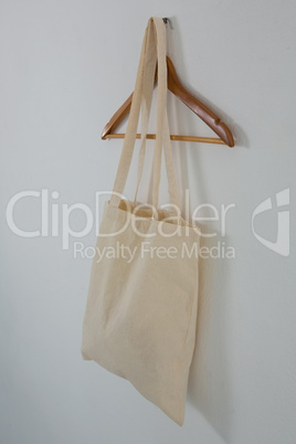 Beige bag on hanger