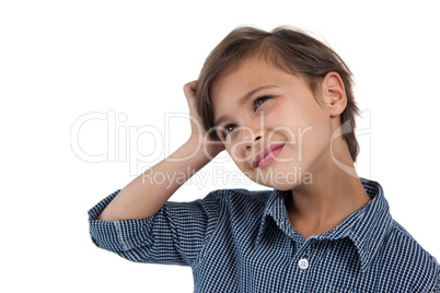 Boy standing against white background