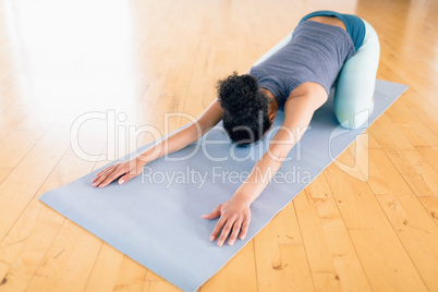 Woman performing stretching exercise in the gym