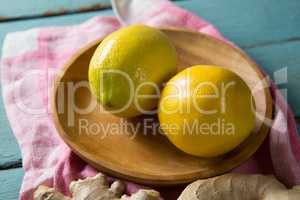 Close up of lemon in wooden plate