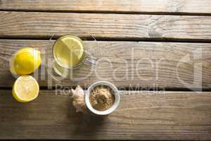 Herbal tea cup with lemon and ginger on table