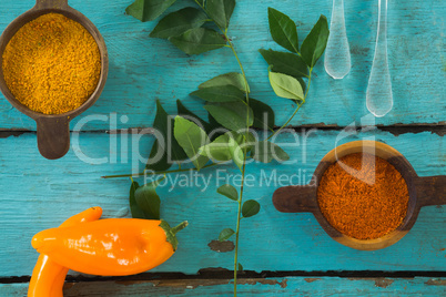 Various spices and herbs on wooden table