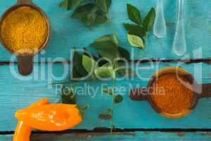 Various spices and herbs on wooden table