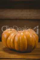 Pumpkin on wooden table during Halloween