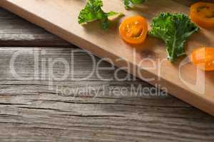 Close up of kale and tomato on cutting board