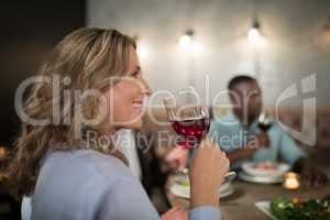 Woman having red wine