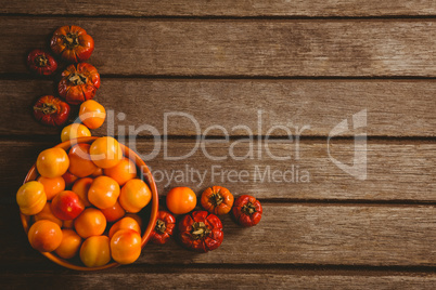 Candies with small pumpkins on wooden table