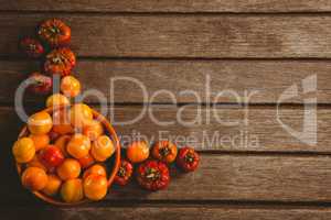 Candies with small pumpkins on wooden table
