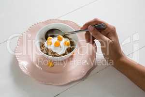 Close-up of womans hand having healthy breakfast