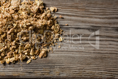 Granola scattered on wooden table