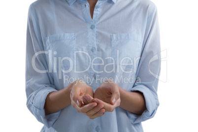 Mid-section of woman pretending to hold an invisible object