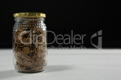 Wheat flakes in glass jar