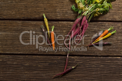 Various root vegetables on wooden table