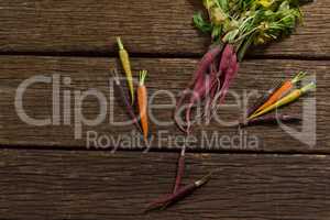 Various root vegetables on wooden table