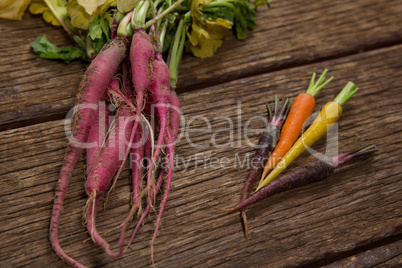 Root vegetables on wooden table