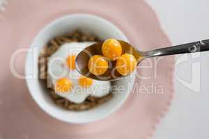 Golden berry in spoon