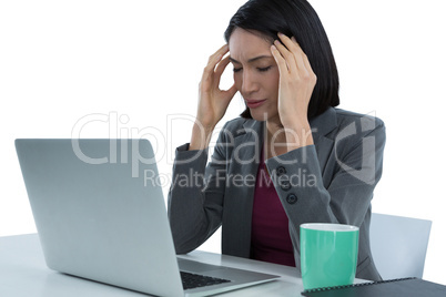 Businesswoman suffering from headache