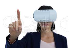 Businesswoman gesturing while using virtual reality headset