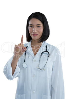 Female doctor touching invisible screen Female doctor touching invisible screen